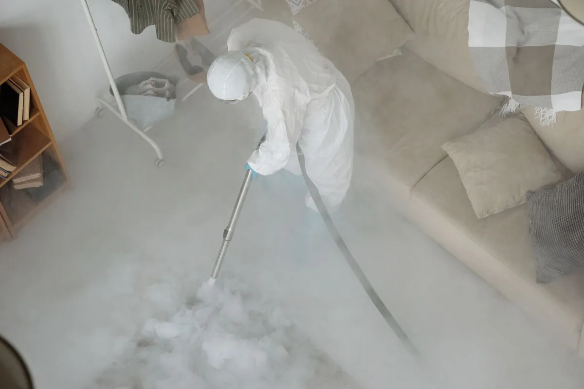 Biohazard cleanup technician in protective equipment, Root Creek, Milwaukee, WI